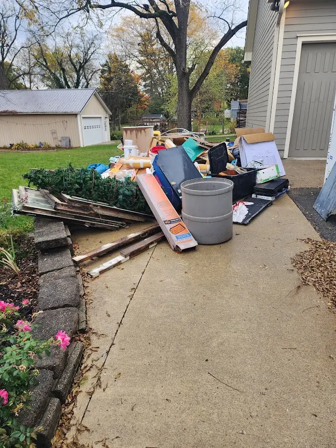Dumpster being loaded with debris for Residential Dumpster Rental in Bowleys Quarters